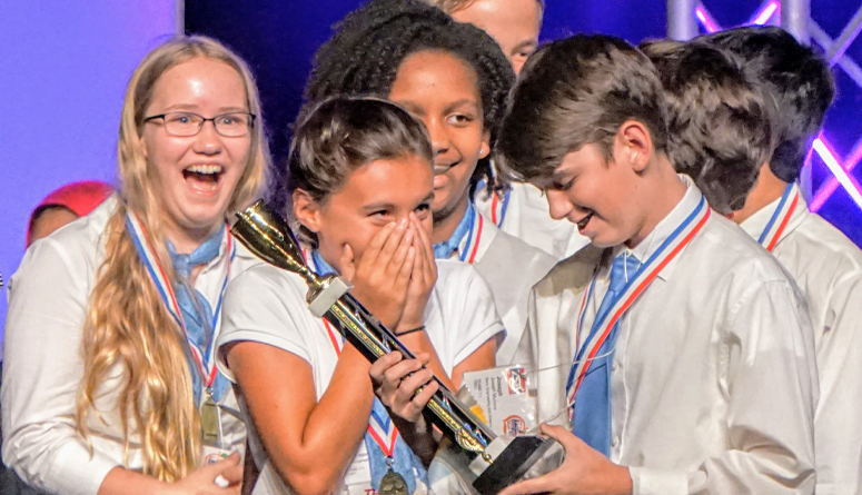 Six students who have just won a trophy.